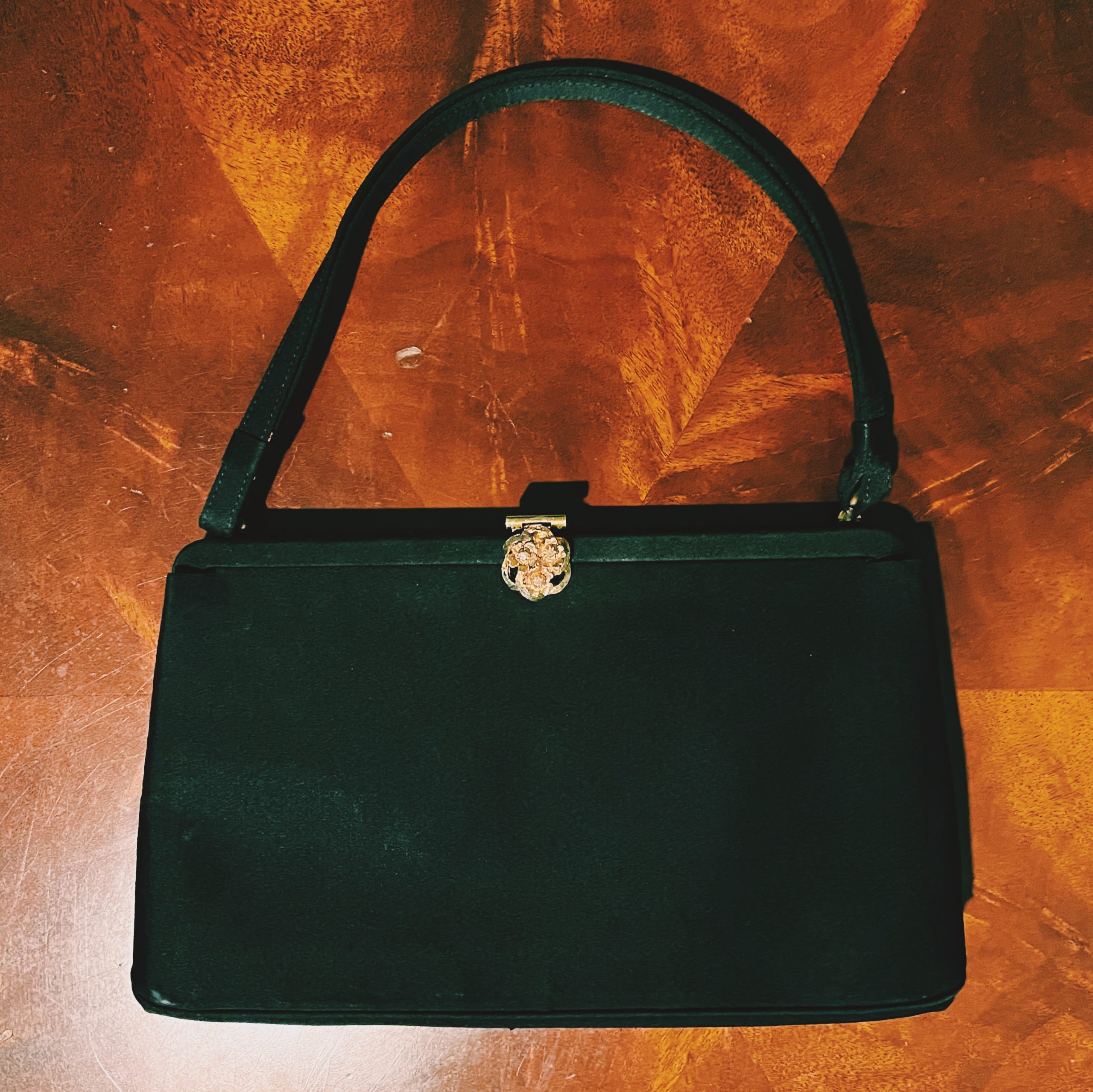 Black satin evening bag with gold clasp--What's in My Evening Bag?